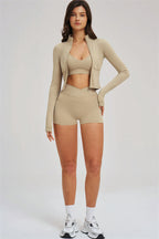 Fitglutes Activewear sports bra, zip jacket, and shorts 3-piece set for workout and gym activities.