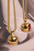 18K gold-plated zircon geometrical shape pendant necklace with modern design, featuring sharp lines and a sleek finish.