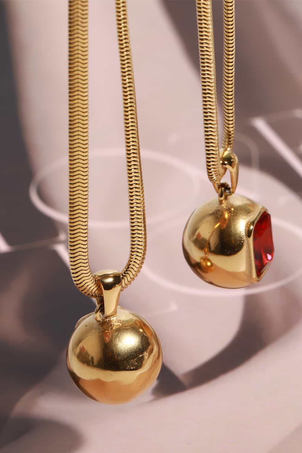 18K gold-plated zircon geometrical shape pendant necklace with modern design, featuring sharp lines and a sleek finish.
