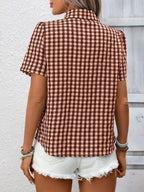 Women's lightweight plaid button-up short sleeve shirt by Trendsi, featuring a classic checkered pattern and casual fit.