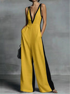 Deep V-neck wide-leg jumpsuit, trendy onesie by Trendsi, featuring a stylish deep V-neckline and comfortable wide-leg design.