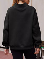 Women's oversized mock neck pullover sweatshirt with dropped shoulders, casual fit, from Trendsi, shown in a relaxed style.