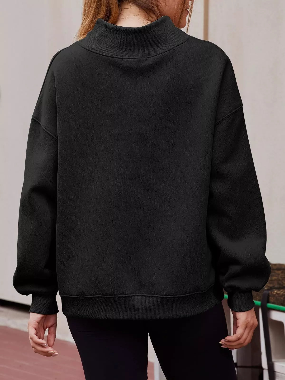 Women's oversized mock neck pullover sweatshirt with dropped shoulders, casual fit, from Trendsi, shown in a relaxed style.