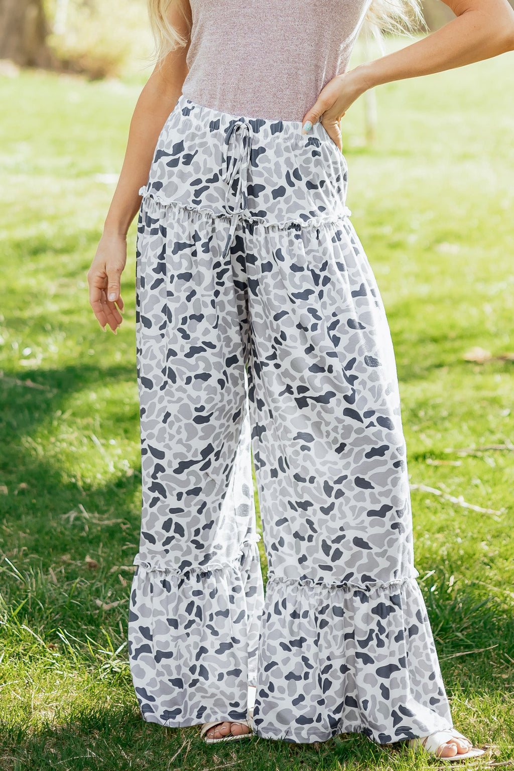 Light beige Hope wide-leg casual pants by Threaded Pear, featuring a relaxed fit and flowing fabric, shown on a model.