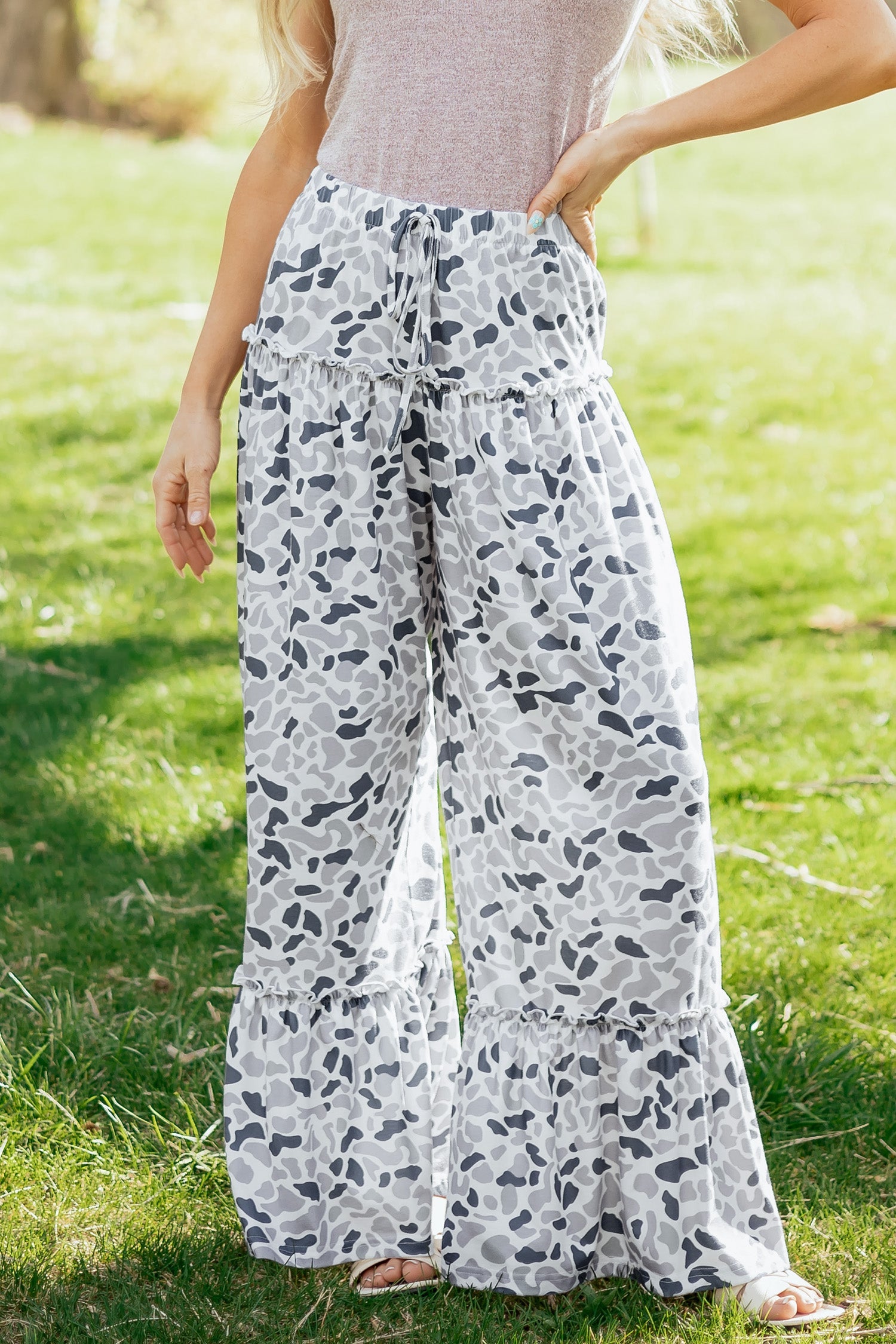 Light beige Hope wide-leg casual pants by Threaded Pear, featuring a relaxed fit and flowing fabric, shown on a model.