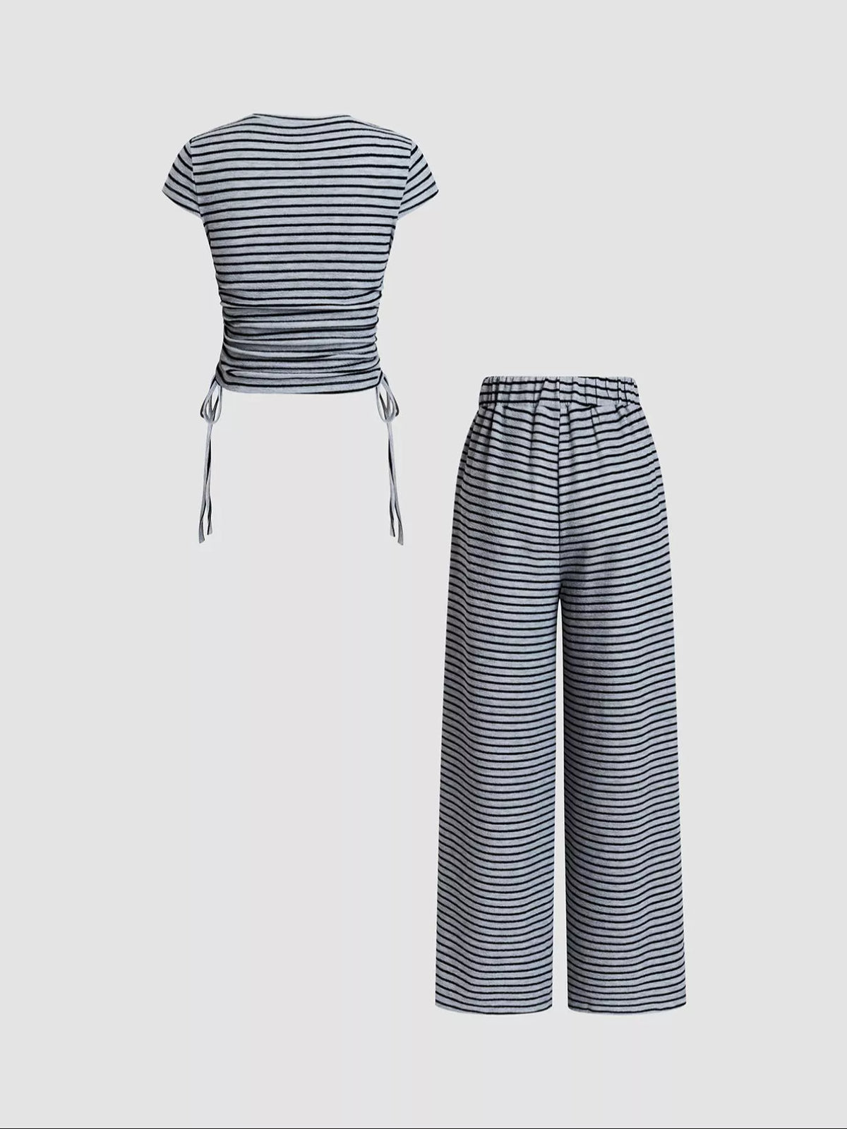 Striped crop top and wide-leg pants outfit set by Plush Fashion Hub, featuring a stylish dress with bold stripe patterns.