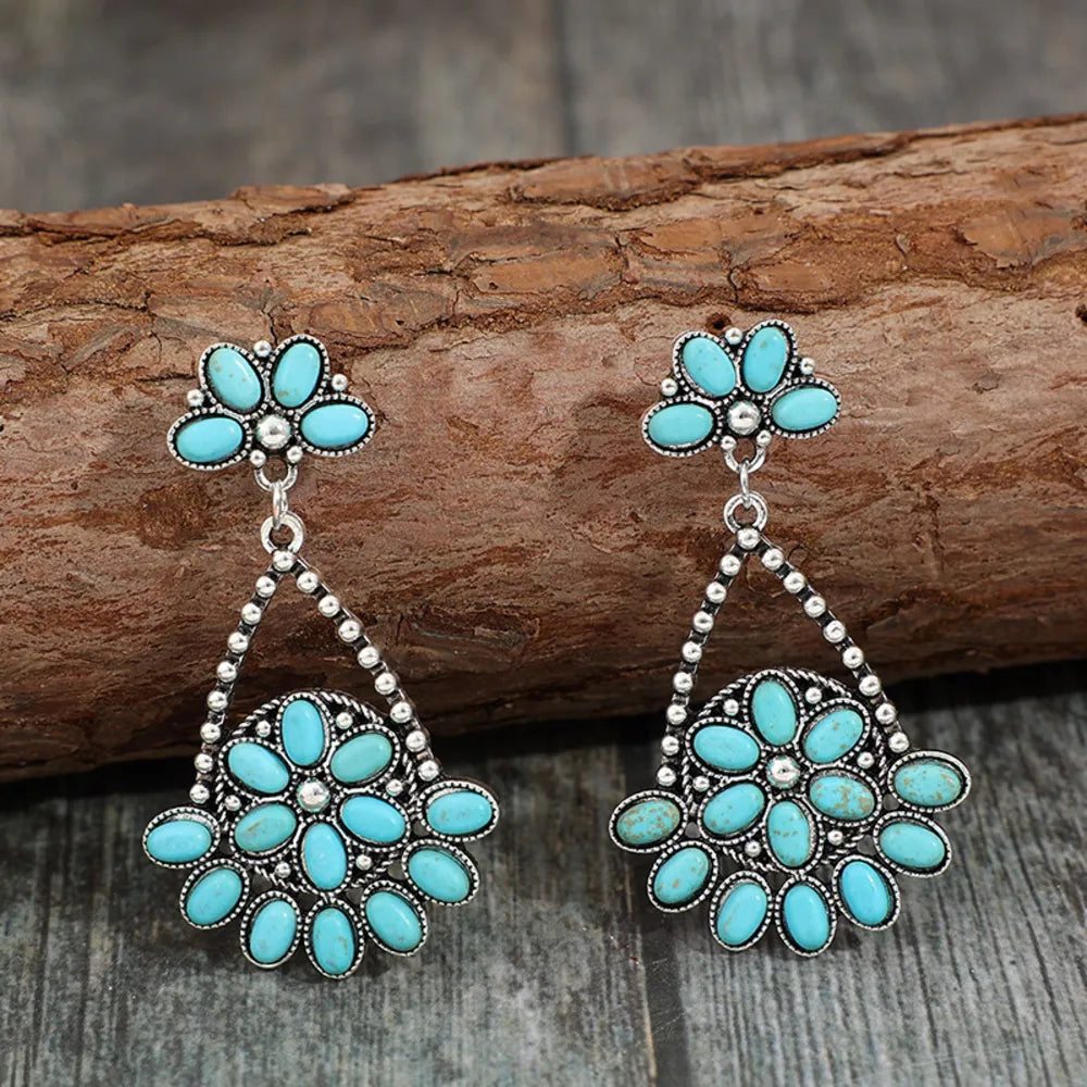 Artificial turquoise teardrop earrings by Plush Fashion Hub featuring vibrant blue gemstone dangles and silver-tone hooks.