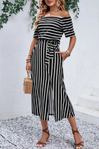 Trendsi Perfee slit off-shoulder tie-waist midi dress featuring a flowing fabric and elegant off-shoulder design.