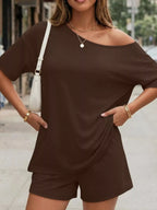 Plus size one-shoulder top and shorts set from Plush Fashion Hub, featuring a stylish and comfortable matching outfit.