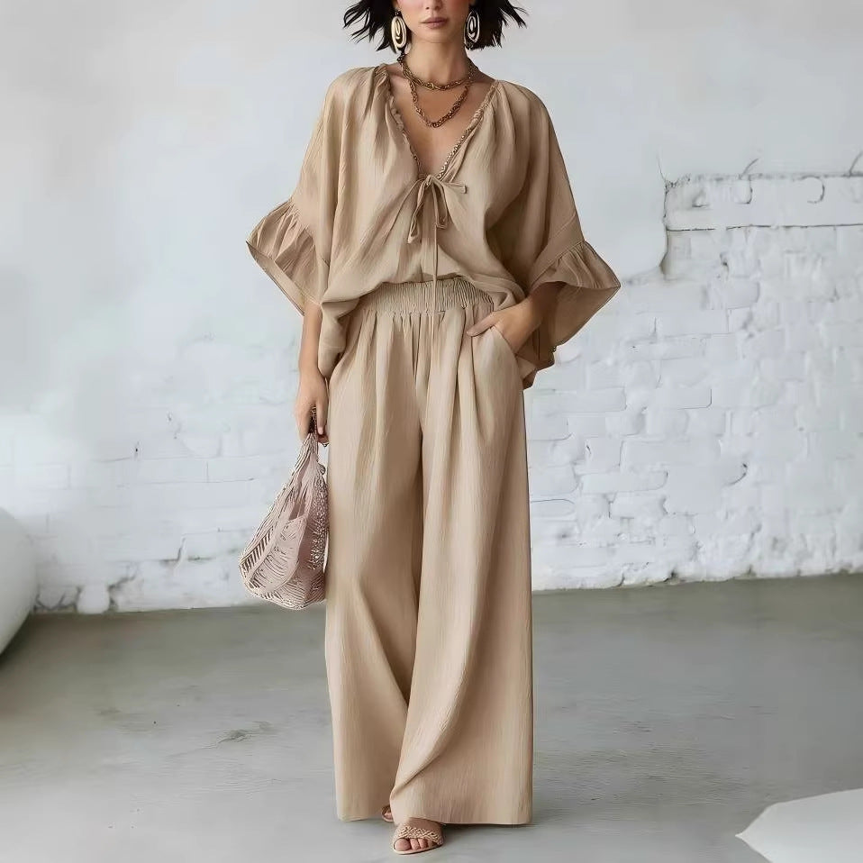 Women's casual two-piece set with loose-fit V-neck top and wide-leg pants by FitiqueFit, shown on a model.