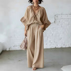 Women's casual two-piece set with loose-fit V-neck top and wide-leg pants by FitiqueFit, shown on a model.