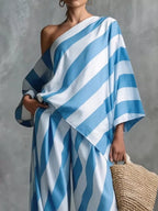 Plus size Shopimist striped one-shoulder top and wide-leg pants set, featuring a stylish, coordinated outfit with bold vertical stripes.