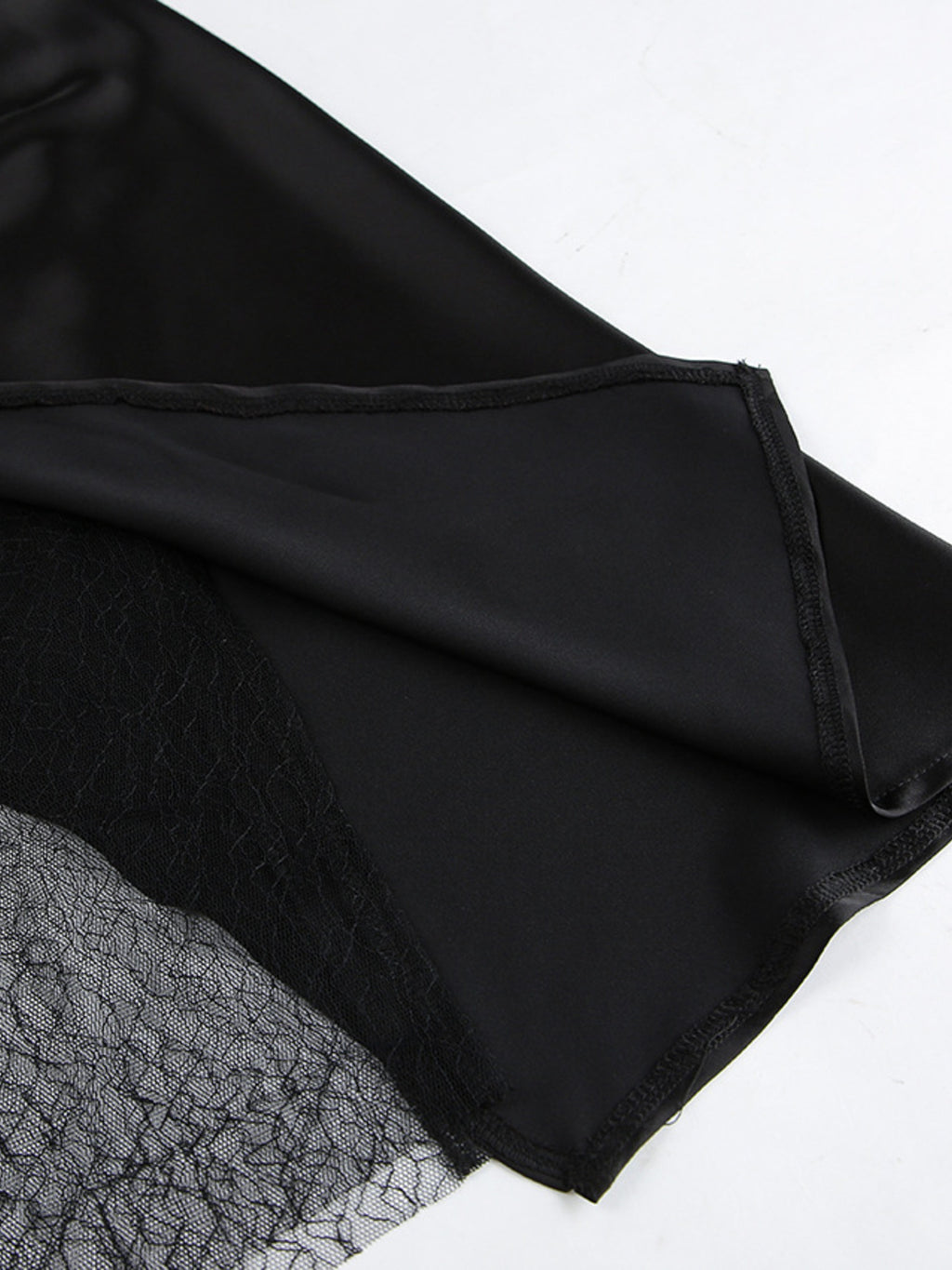 Women's elegant lace midi skirt with sheer split detail, featuring a flowing design for stylish and sophisticated women's apparel.