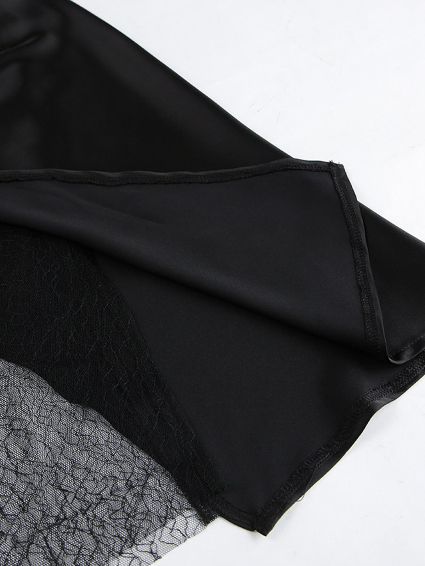 Women's elegant lace midi skirt with sheer split detail, featuring a flowing design for stylish and sophisticated women's apparel.