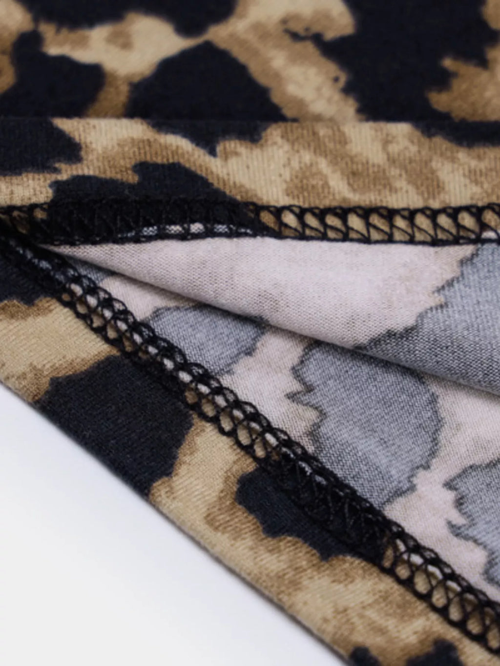Leopard print spaghetti strap midi dress by Shopimist, featuring a fitted silhouette and stylish animal print fabric.