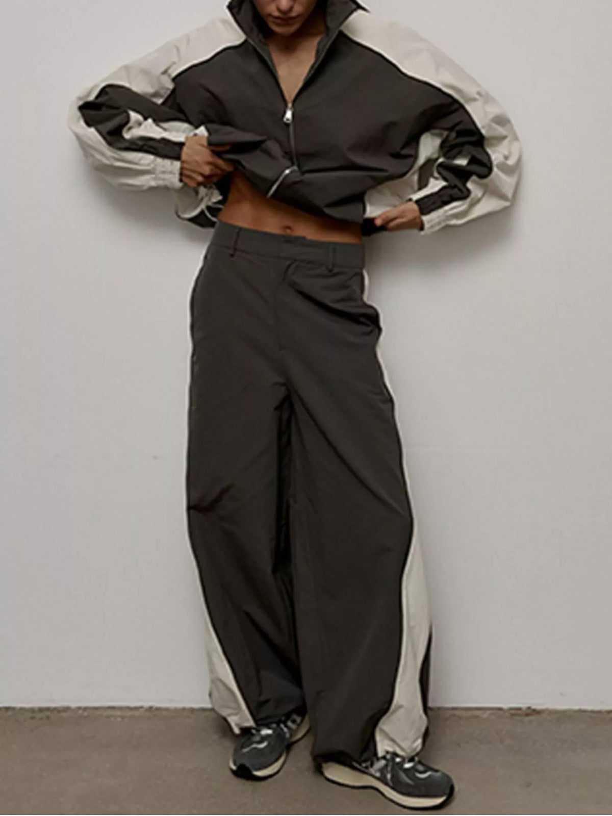Color block zip-up outerwear and pants set by Plush Fashion Hub, featuring vibrant color blocks and a sporty fit.