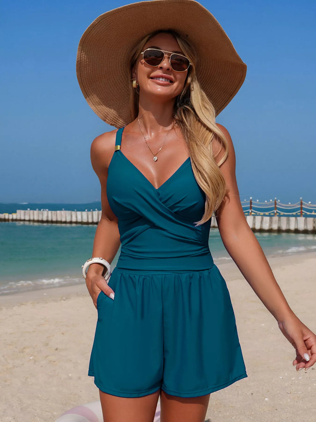 Women's V-neck spaghetti strap one-piece swimsuit from Trendsi, featuring stretchy beachwear fabric and a stylish swimwear design.