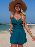 Women's V-neck spaghetti strap one-piece swimsuit from Trendsi, featuring stretchy beachwear fabric and a stylish swimwear design.
