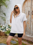 Light gray half zip short sleeve hooded top from Trendsi, featuring a relaxed fit and front zipper detail.