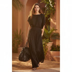Women's chiffon high-waist ruched maxi dress by FitiqueFit, flowing fabric with ruching detail, full-length dress on a model.