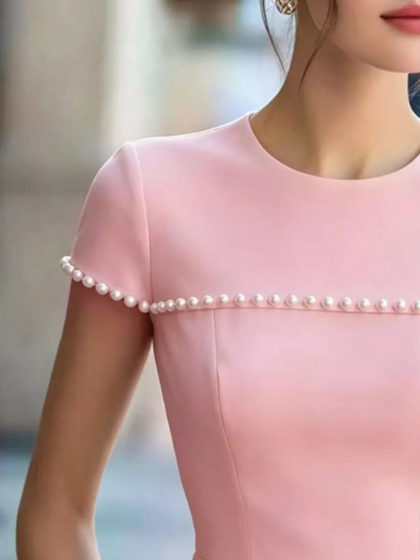 Pearl-embellished peplum T-shirt from Shopimist, featuring a fitted silhouette with pearl accents and short sleeves.