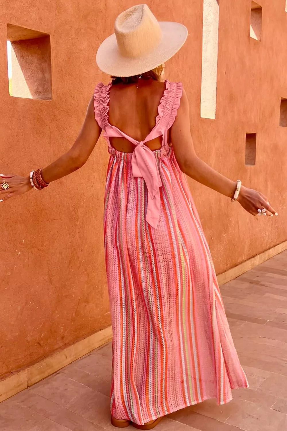 Stripe ruffled straps ribbon knot flowy maxi dress by Plush Fashion Hub, featuring a breezy, elegant vacation style with a flowing silhouette.