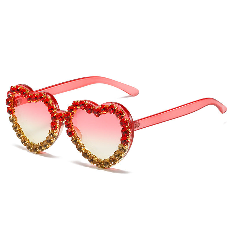 Peach heart-shaped rhinestone sunglasses from Plush Fashion Hub, Y2K INS style eyewear with sparkling rhinestone details.