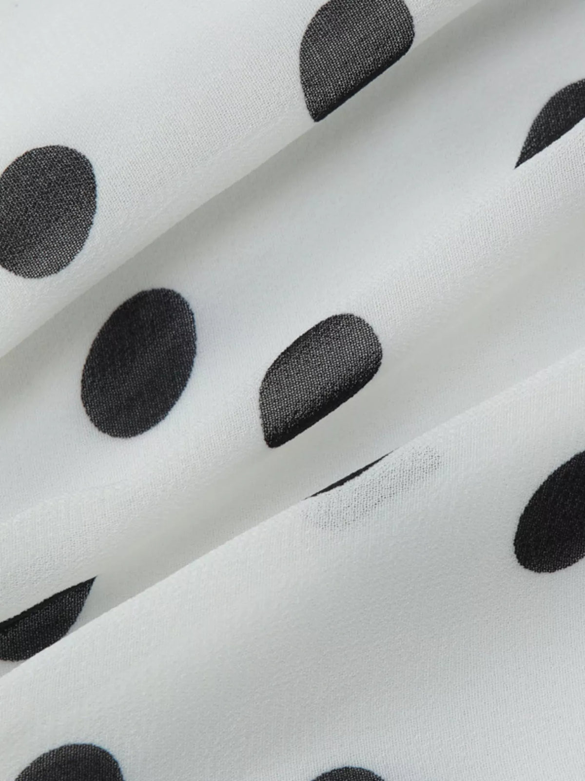 Polka dot halter neck ruffle dress by Plush Fashion Hub, featuring a playful pattern and feminine ruffle details.