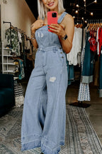 Women's distressed wide leg denim overalls with casual relaxed fit, featuring distressed details and adjustable shoulder straps.