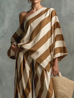 Plus size Shopimist striped one-shoulder top and wide-leg pants set, showcasing the stylish, coordinated outfit on a model.