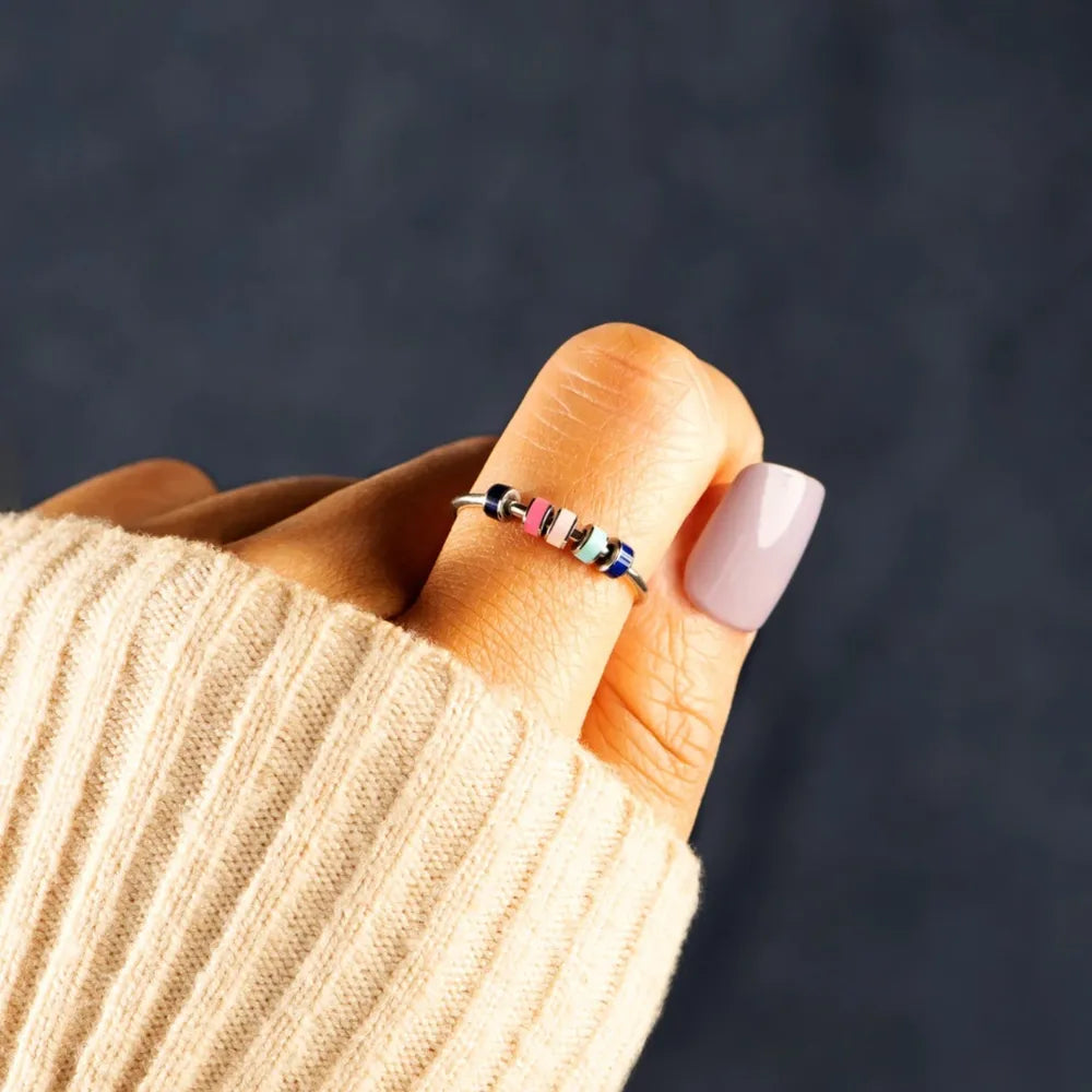 Sterling silver oil drip ring by Shopimist featuring a sleek, modern design with textured silver finish on a white background.