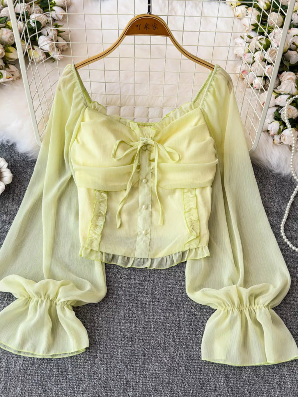Women's elegant frill flounce sleeve smocked blouse in lightweight polyester, stylish dress by Trendsi with feminine details.