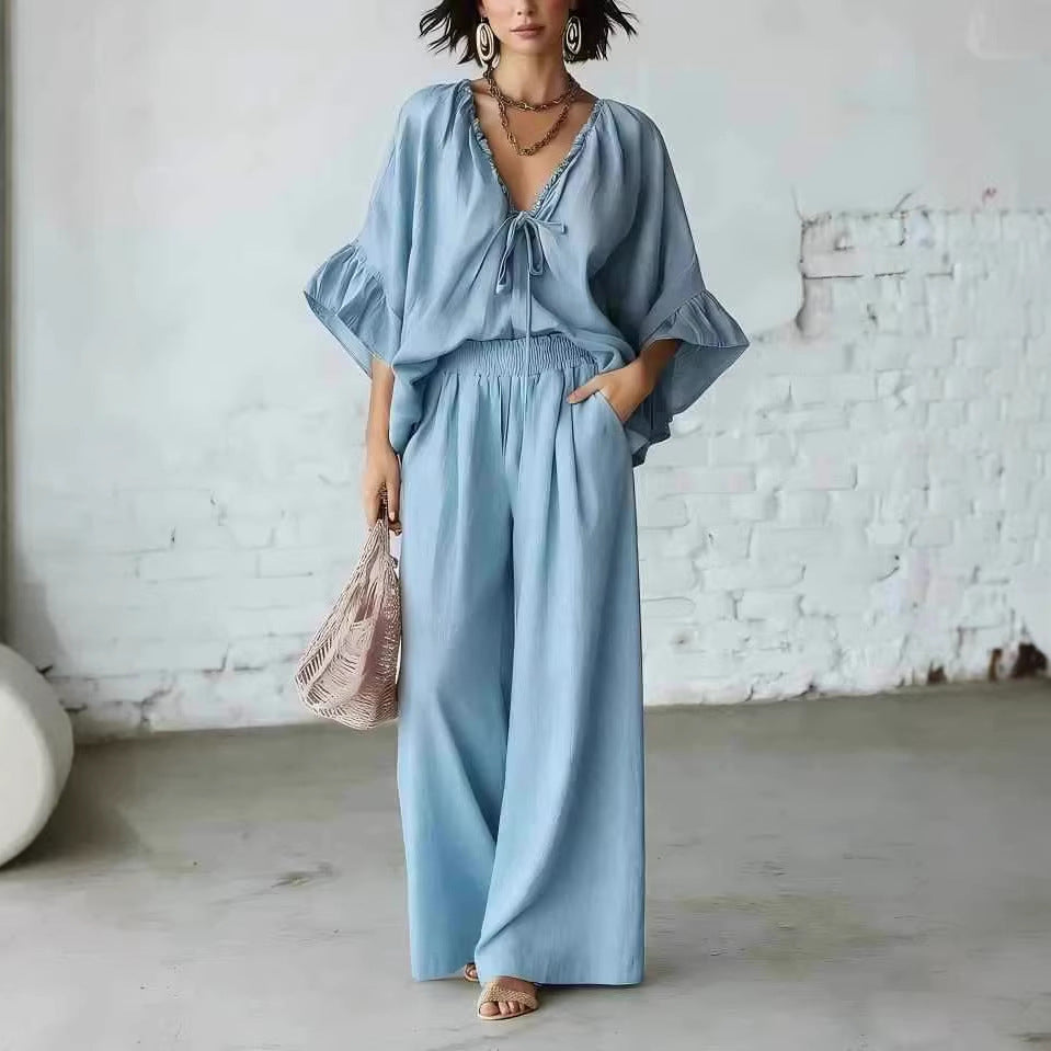 Women's loose-fit V-neck top and wide-leg pants casualwear set by FitiqueFit, featuring comfortable, stylish two-piece outfit.