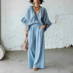 Women's loose-fit V-neck top and wide-leg pants casualwear set by FitiqueFit, featuring comfortable, stylish two-piece outfit.