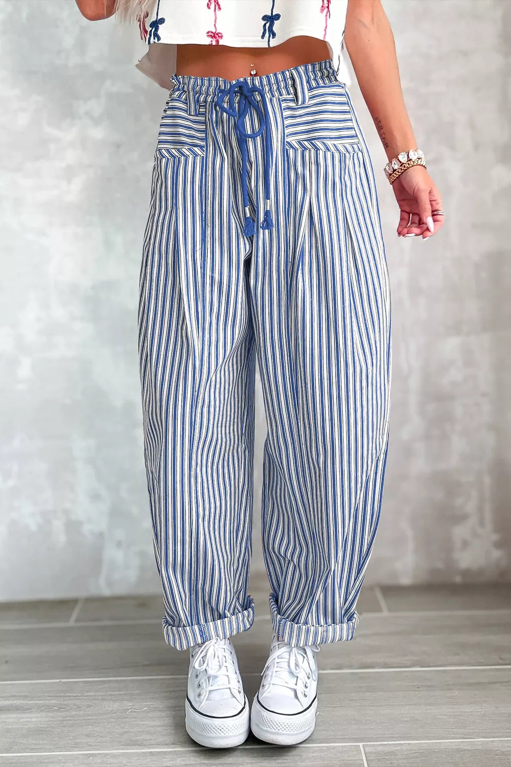 Light beige stripe drawstring casual loose pants from Trendsi featuring relaxed fit, elastic waistband, and lightweight fabric.