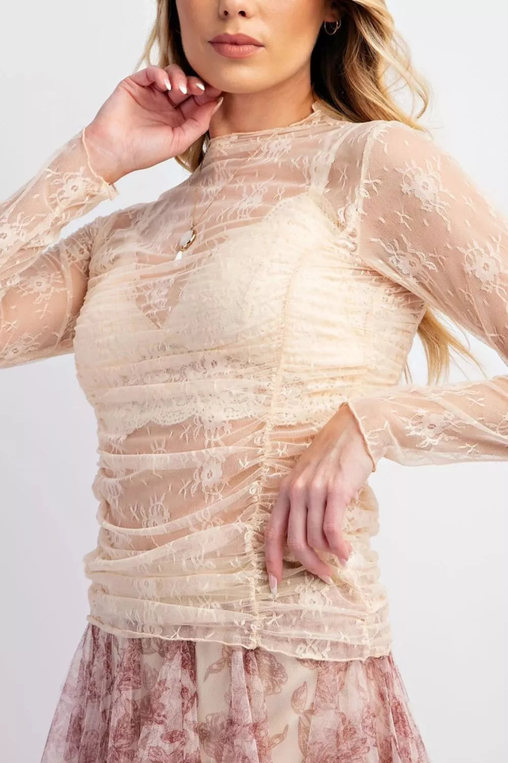 Sheer floral mesh long sleeve top with ruched design, stylish and lightweight, from Trendsi.