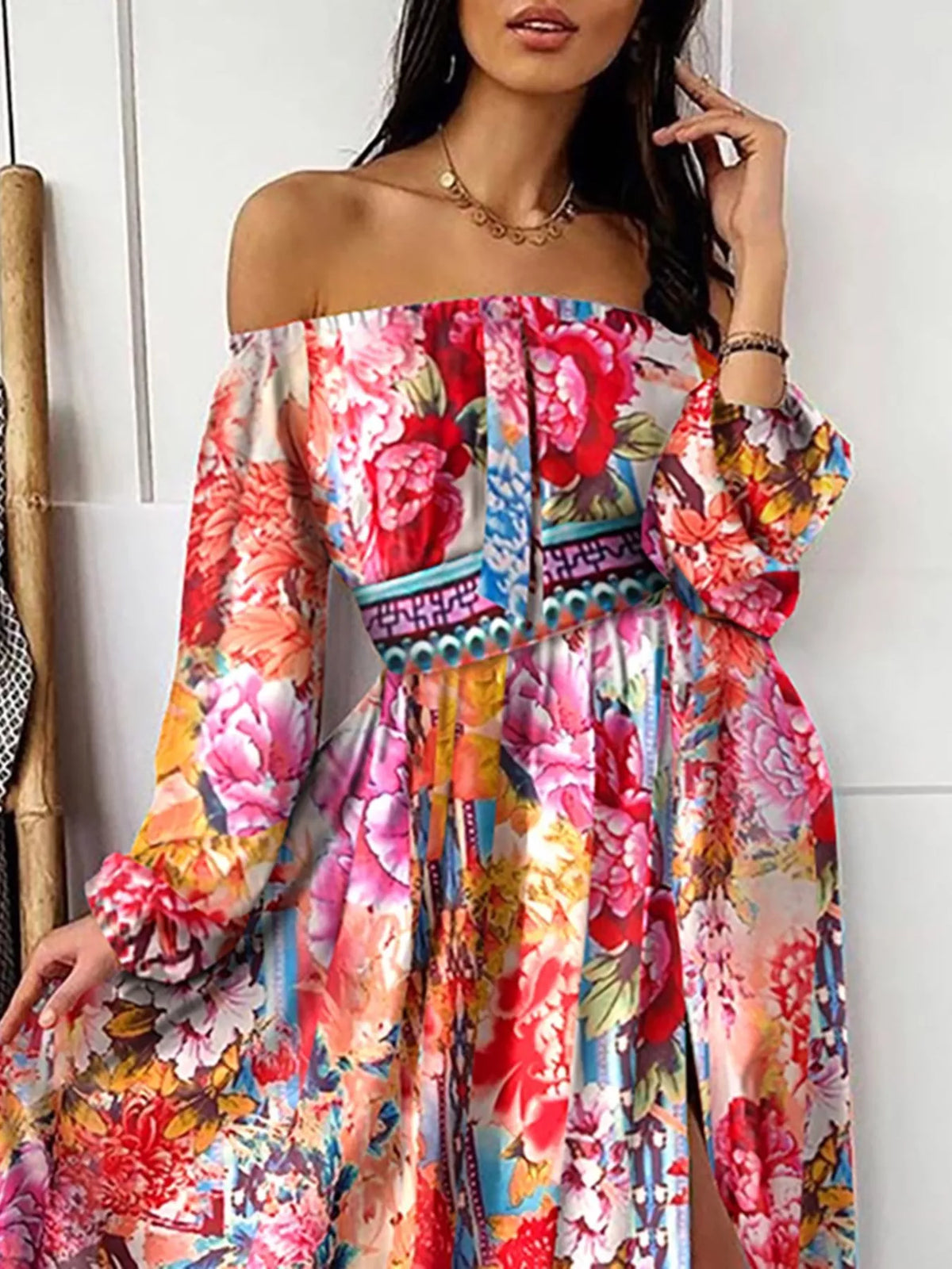 Plush Fashion Hub off shoulder printed maxi dress with slit, flowing fabric, and vibrant pattern suitable for casual or formal wear.
