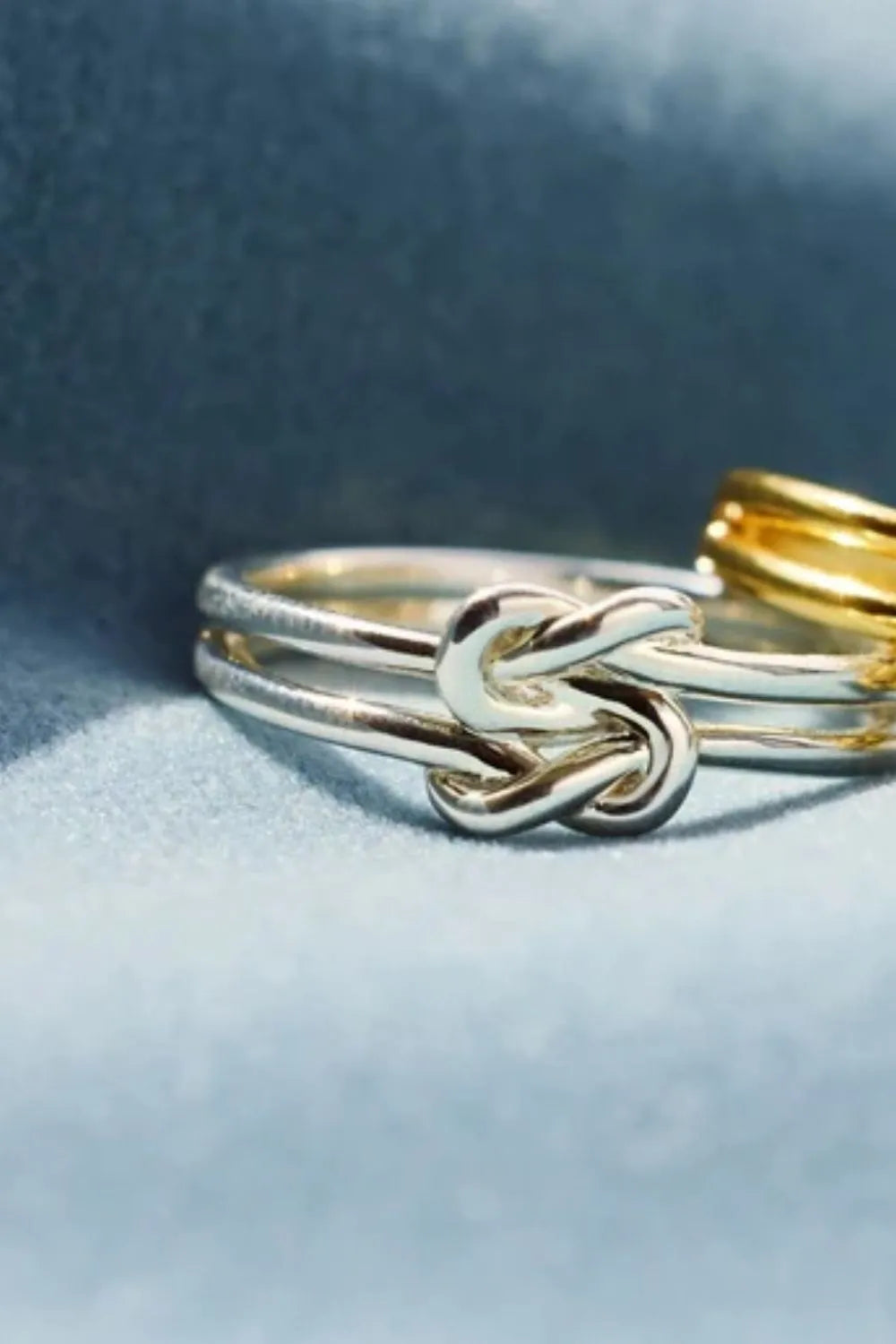 925 Sterling Silver Knotted Ring, elegant jewelry piece with a twisted knot design, showcasing craftsmanship and shine.