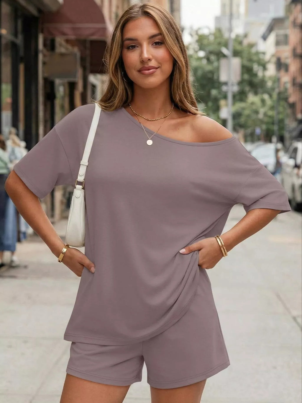 Plus size women's boat neck T-shirt and shorts lounge set by Trendsi, casual and comfortable clothing set for relaxed wear.