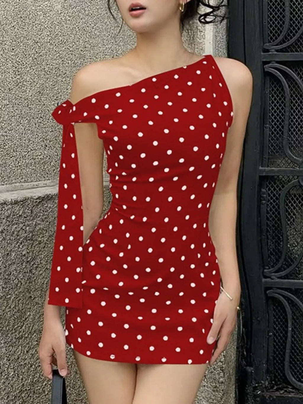 Polka dot sleeveless mini dress with bow accents from Shopimist, showcasing a playful, feminine design with a fitted silhouette.