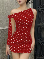 Polka dot sleeveless mini dress with bow accents from Shopimist, showcasing a playful, feminine design with a fitted silhouette.