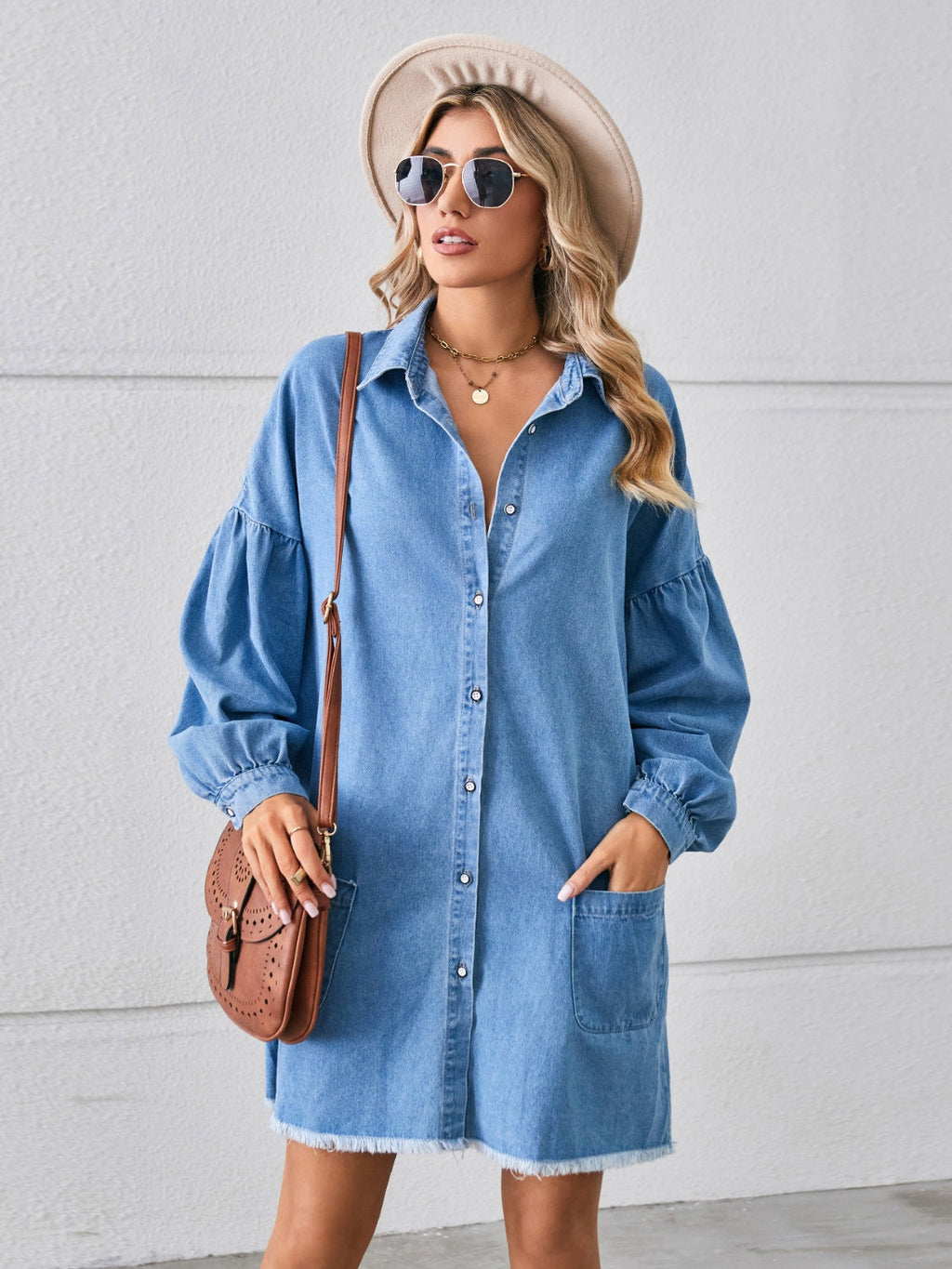 VYSN denim dress with button-up front, pocket details, and raw hem, casual fashion clothing for a stylish look.