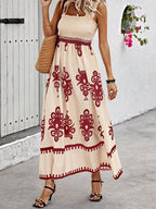 Plush Fashion Hub smocked printed wide strap maxi dress with a flowing silhouette and vibrant floral pattern.