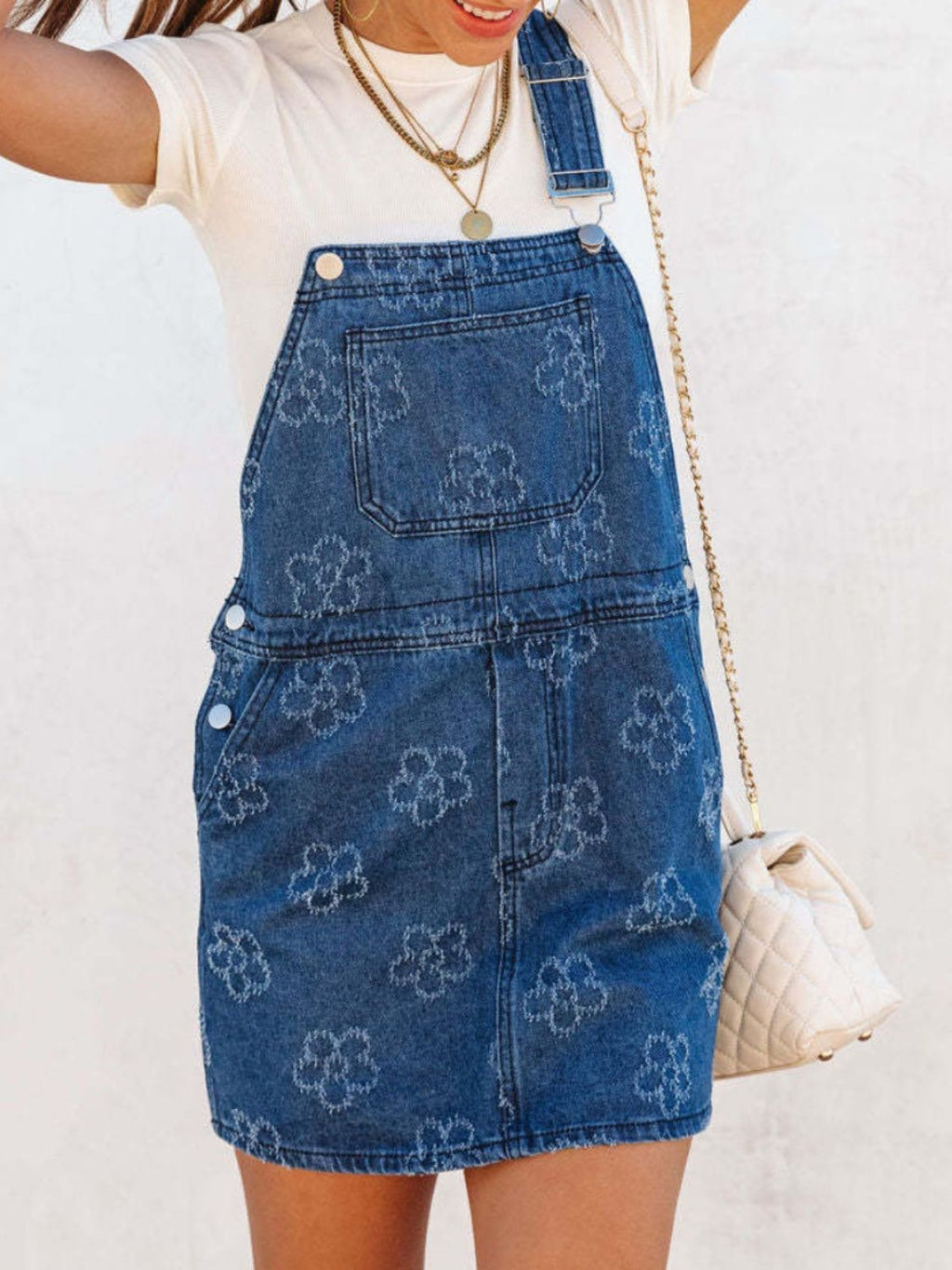 VYSN flower wide strap denim overall dress with pockets, featuring a casual sleeveless style and floral print detail.