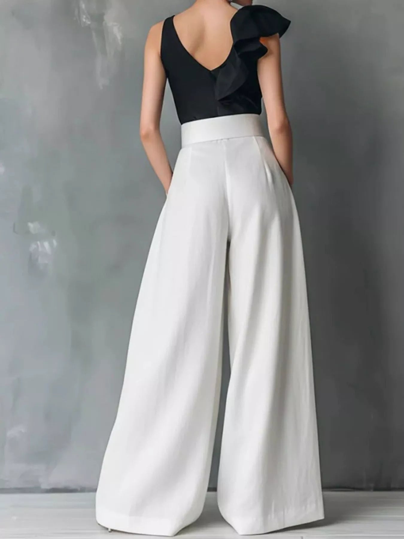 High-waisted wide-leg pants from Plush Fashion Hub displayed on a hanger with a neutral background.
