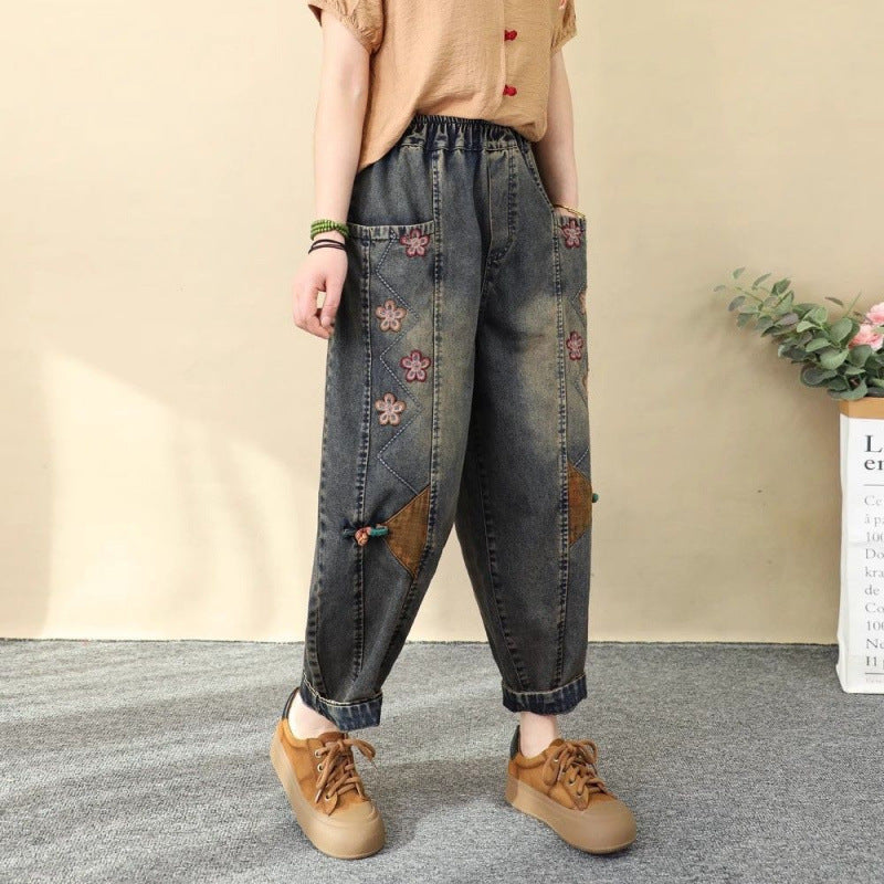 Women's patchwork embroidered cropped harem pants by FitiqueFit, featuring wide-leg denim with high waist and colorful embroidered details.