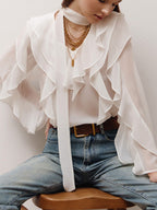Elegant chiffon blouse with ruffle trim and tie neck detail, featuring a stylish, flowy design perfect for sophisticated looks.