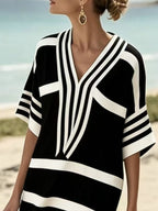 Plus size women's striped half-sleeve midi dress from Plush Fashion Hub, casual chic everyday wear, featuring a fitted waist and knee-length hem.