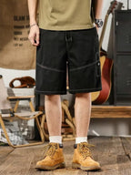 Men's plus size casual shorts with drawstring waist and deep pockets, relaxed fit, from Trendsi.