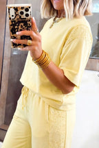 Plush Fashion Hub rings set featuring a half sleeve top and drawstring pants with decorative rings on the fabric.